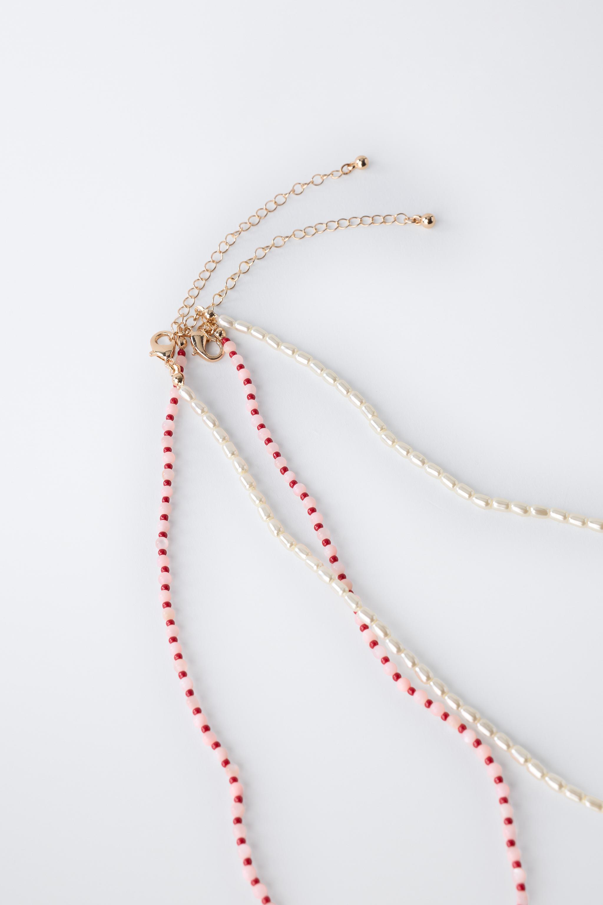 LOT DE DEUX COLLIERS PERLES ET FANTAISIE MER